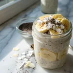 Electrolyte overnight oats with banana and chia in a mason jar