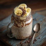 Chocolate banana overnight oats in a mason jar with banana slices